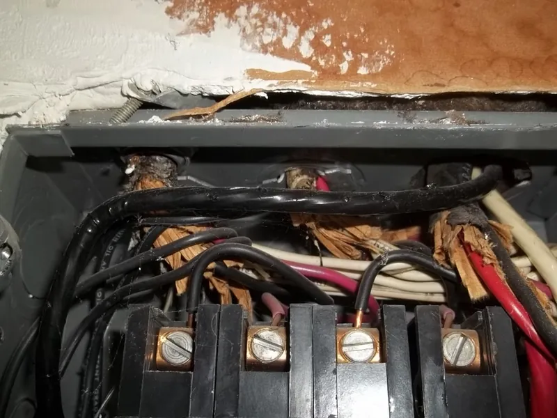 Scorched, heat-damaged wiring at electrical connection lugs