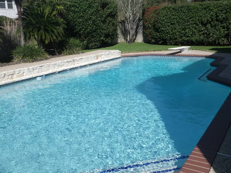 A backyard swimming pool during an inspection