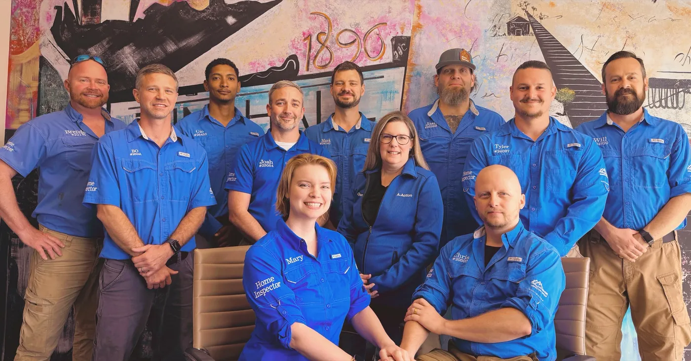 The A-Action Home Inspection Group team lined up in their blue uniform shirts