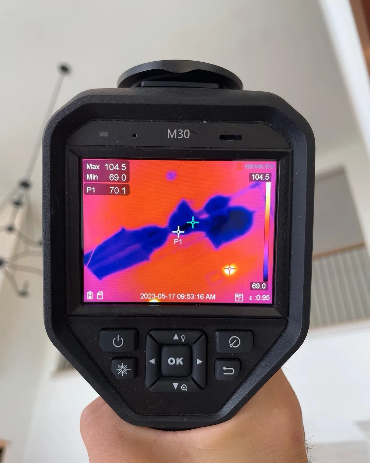 An A-Action inspector's FLIR thermal camera showing a live scan of a ceiling